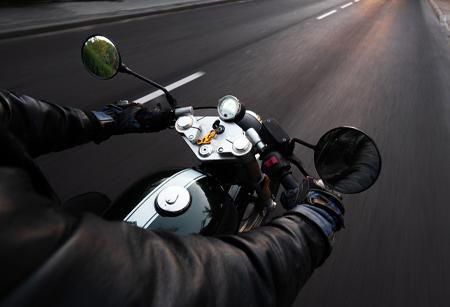 First person view of of someone riding on a motorcycle